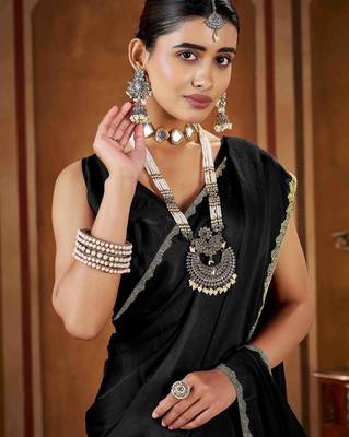 Party wear new rangoli silk black color saree with blouse and stone lace border 5