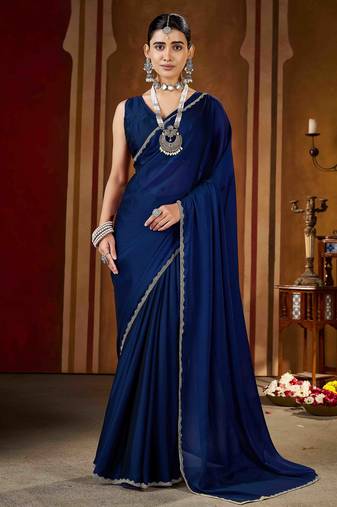 Party wear new rangoli silk navy blue color saree with blouse and stone lace border