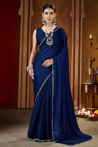 Party wear new rangoli silk navy blue color saree with blouse and stone lace border