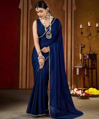Party wear new rangoli silk navy blue color saree with blouse and stone lace border 2