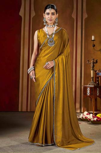 Party wear new rangoli silk golden color saree with blouse