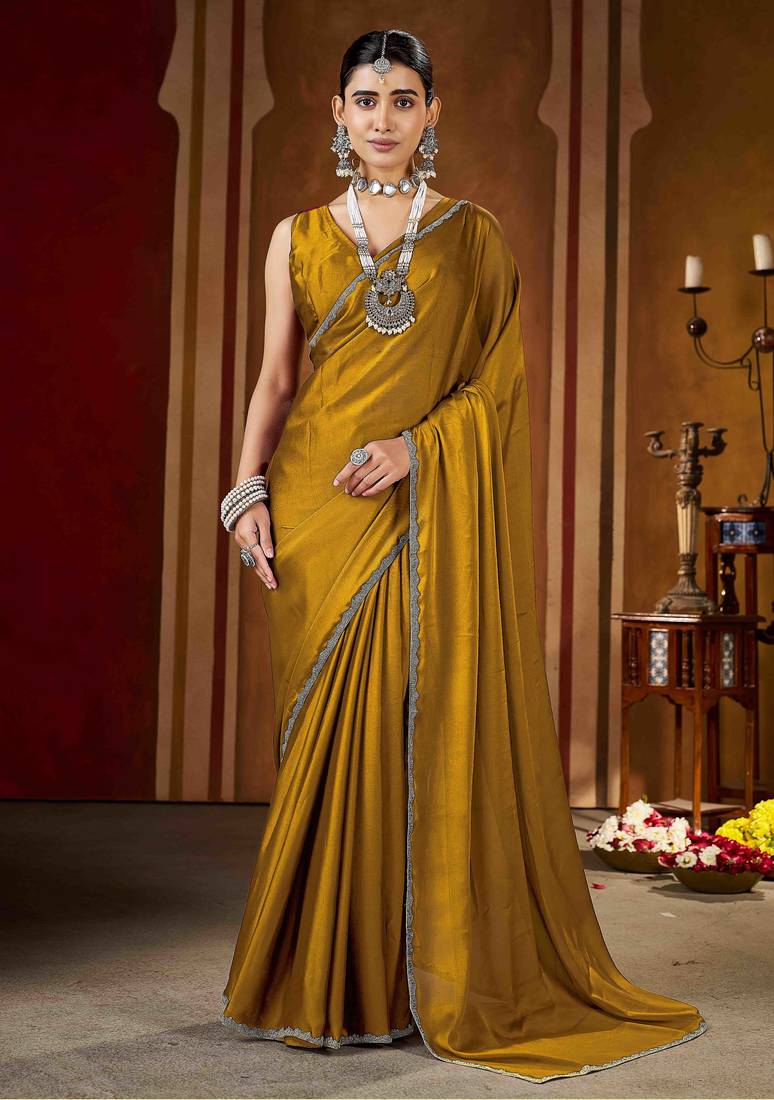 Party wear new rangoli silk golden color saree with blouse