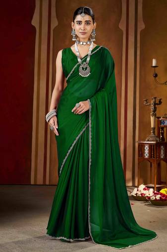Party wear new rangoli silk green color saree with blouse and stone lace border