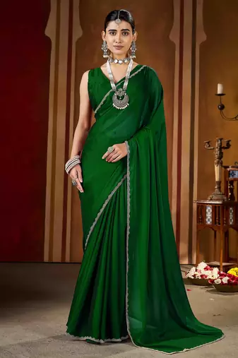 Party wear new rangoli silk green color saree with blouse and stone lace border