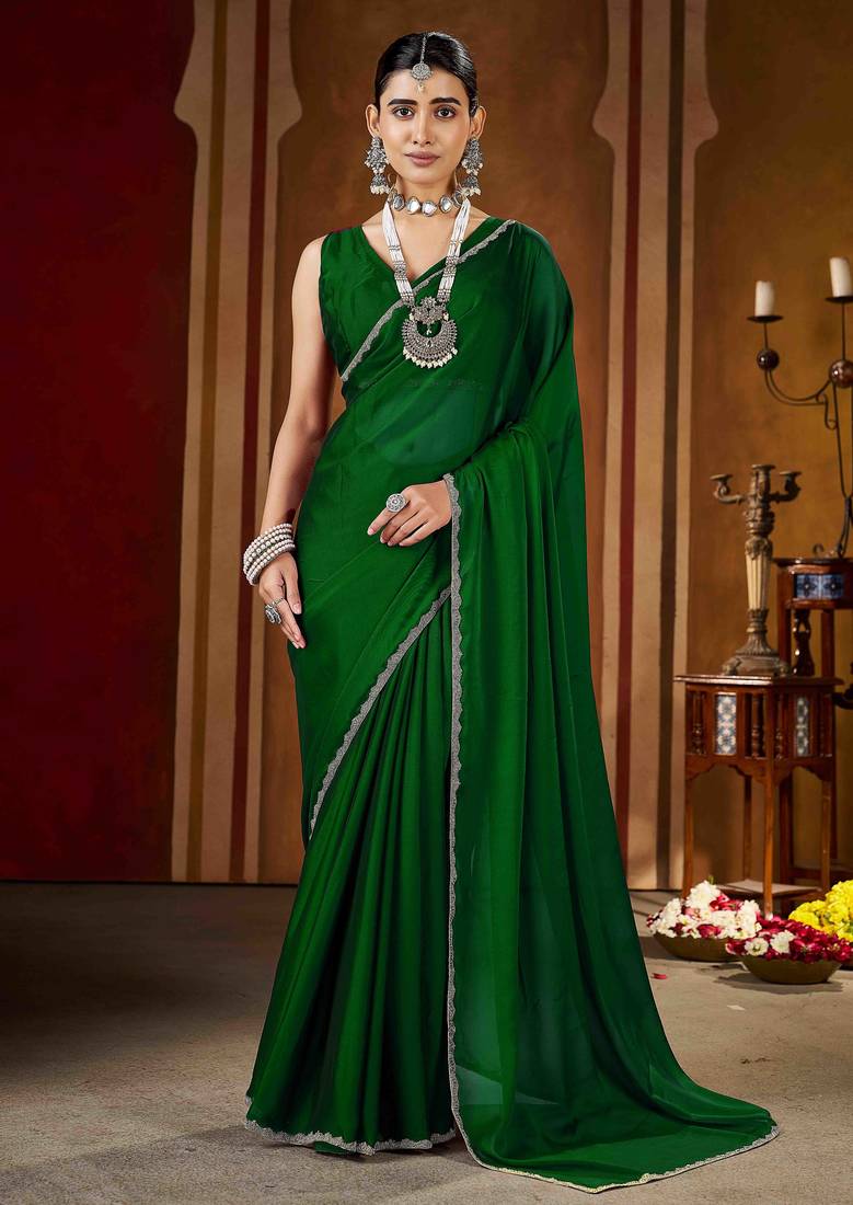 Party wear new rangoli silk green color saree with blouse and stone lace border