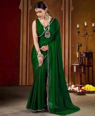 Party wear new rangoli silk green color saree with blouse and stone lace border 2