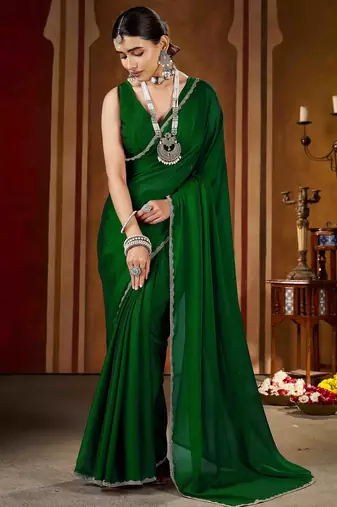 Party wear new rangoli silk green color saree with blouse and stone lace border