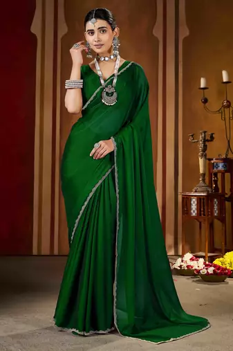 Party wear new rangoli silk green color saree with blouse and stone lace border