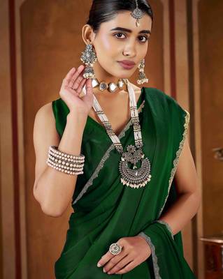 Party wear new rangoli silk green color saree with blouse and stone lace border 5