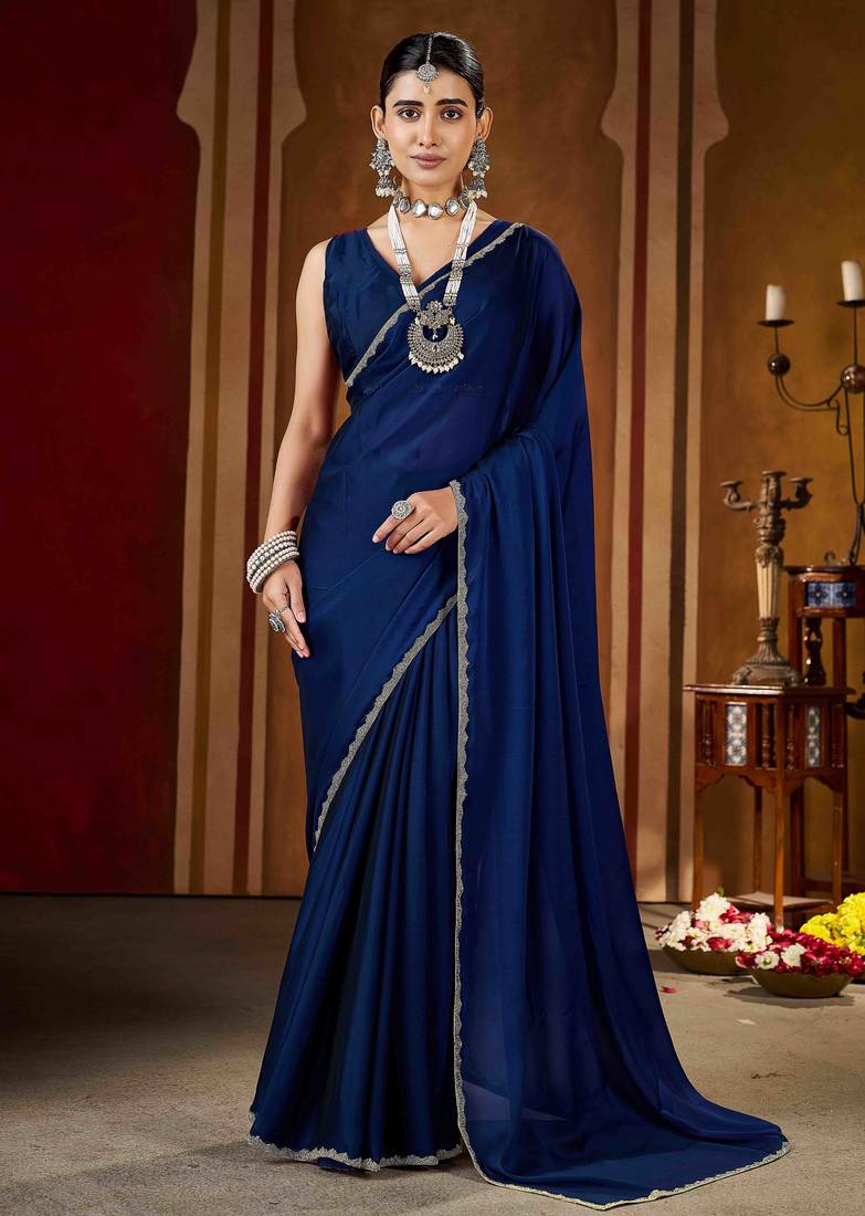 Party wear navy blue rangoli silk saree with fancy lace border