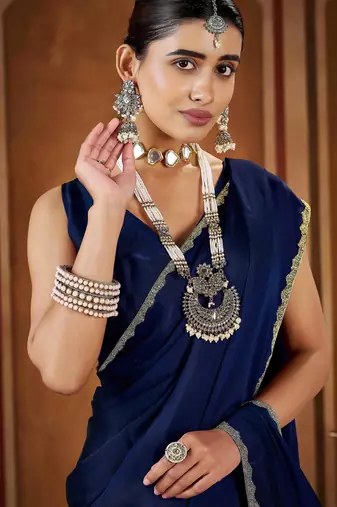 Party wear navy blue rangoli silk saree with fancy lace border