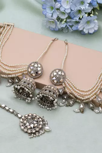 Gold color kundan earrings tikka set