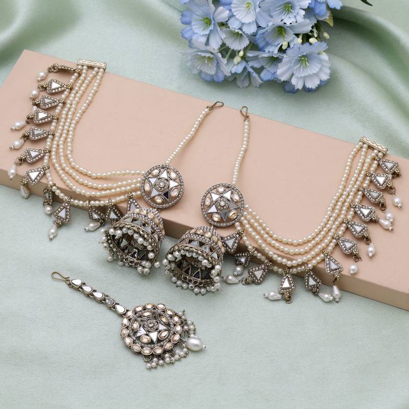 Gold color kundan earrings tikka set