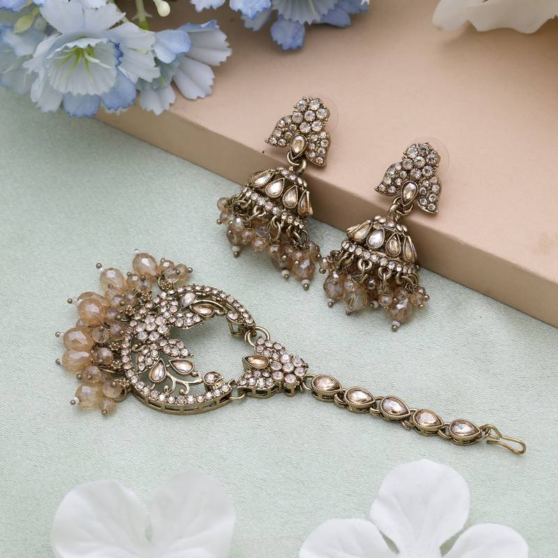 Gold color kundan earrings tikka set