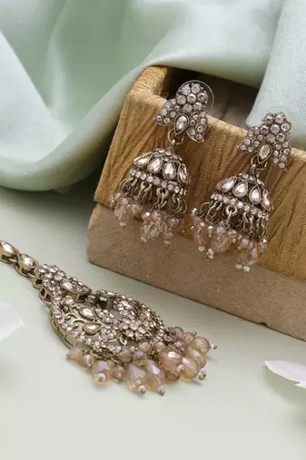 Gold color kundan earrings tikka set