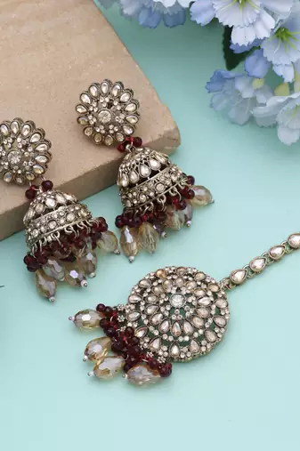 Maroon color kundan earrings tikka set