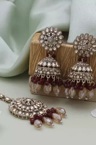 Maroon color kundan earrings tikka set