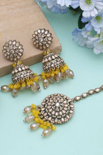 Yellow color kundan earrings tikka set