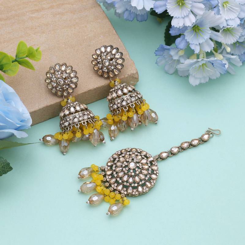 Yellow color kundan earrings tikka set