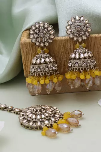Yellow color kundan earrings tikka set