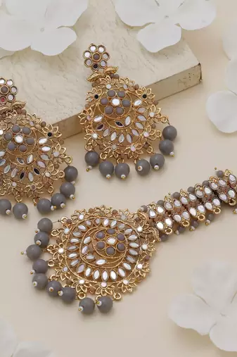 Grey color kundan earrings tikka set