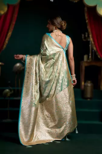 Sky blue premium satin silk blend saree with stylish pom-pom pallu