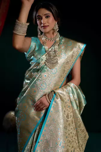 Sky blue premium satin silk blend saree with stylish pom-pom pallu