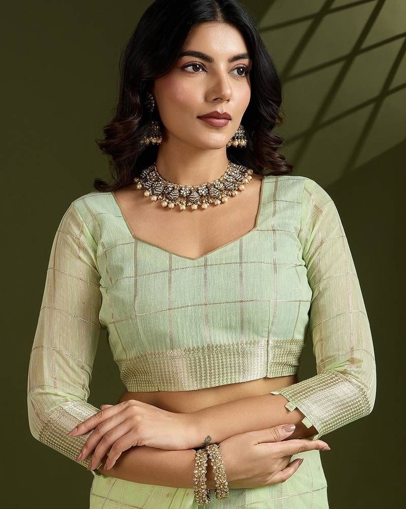 green solid tissue saree with blouse
