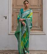 Green solid silk blend saree with blouse
