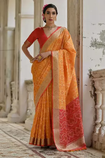 Orange solid raw silk blend saree with blouse