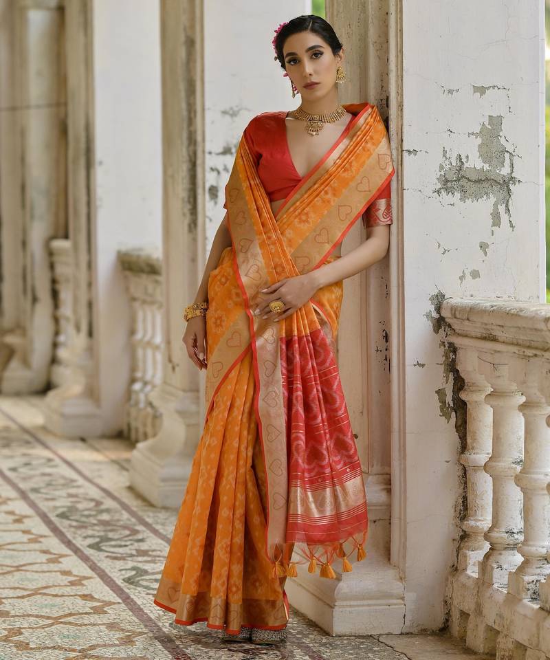 Orange solid raw silk blend saree with blouse
