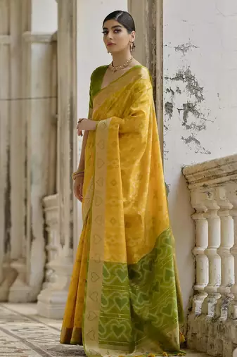 yellow solid raw silk blend saree with blouse