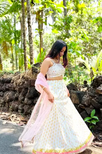 white banarasi georgette lehenga choli with gold motifs