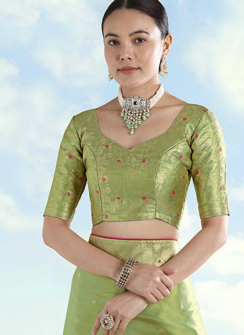 Parrot green color paisley zari woven faux banarasi tissue silksaree