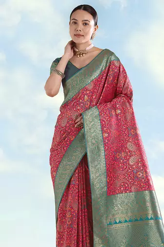 Rani pink faux banarasi silk blend saree with traditional paisley weaves
