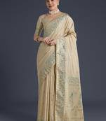 Cream faux banarasi satin silk saree with zari border and butti work