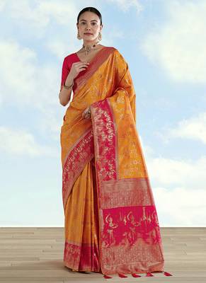Orange faux banarasi silk blend saree with zari woven design 1