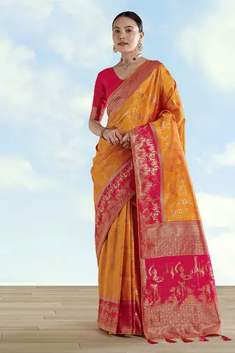 Orange faux banarasi silk blend saree with zari woven design