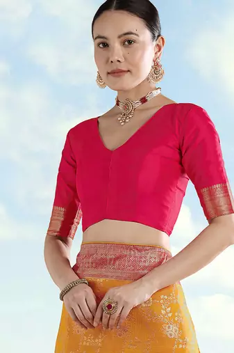 Orange faux banarasi silk blend saree with zari woven design