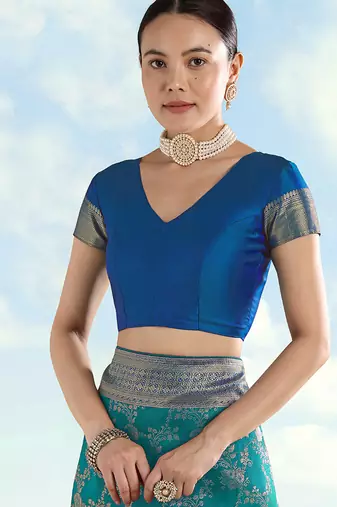 Turquoise faux banarasi silk blend saree with zari woven design
