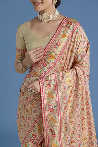 Cream faux banarasi satin silk blend saree with patola work