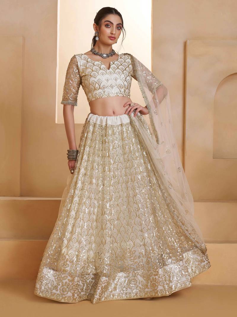 Off White net sequin embroidered lehenga set with choli and dupatta