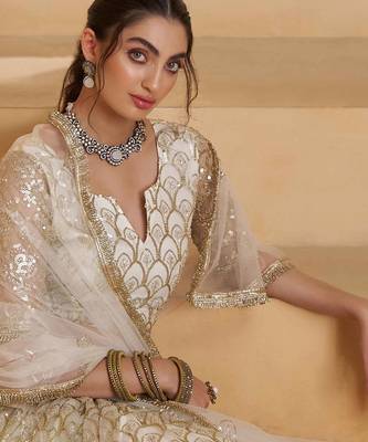 Off White net sequin embroidered lehenga set with choli and dupatta 4