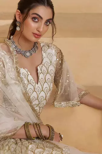 Off White net sequin embroidered lehenga set with choli and dupatta