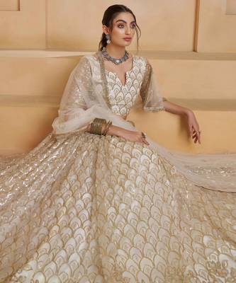 Off White net sequin embroidered lehenga set with choli and dupatta 5