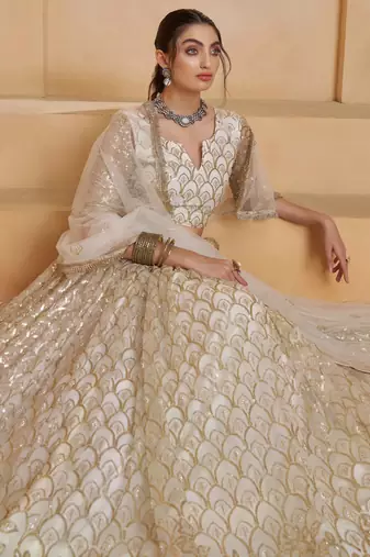 Off White net sequin embroidered lehenga set with choli and dupatta