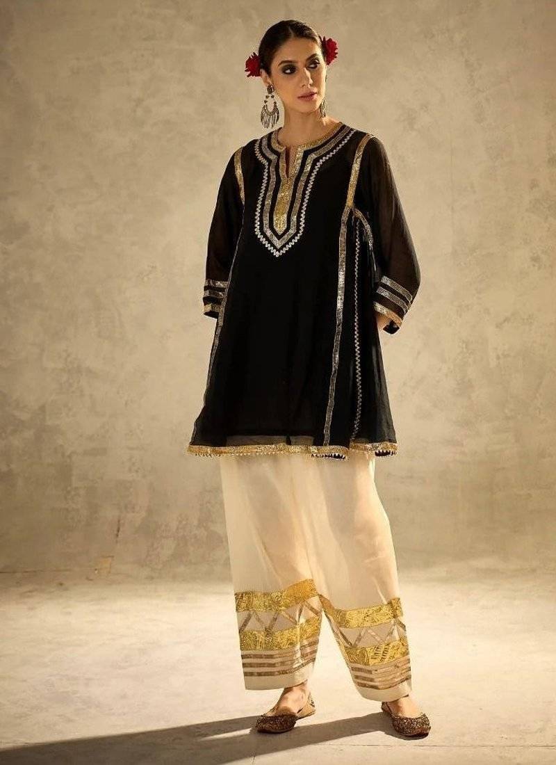 black flared kurta with gold border palazzo