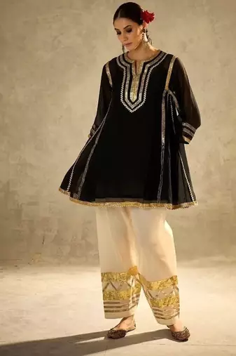 black flared kurta with gold border palazzo