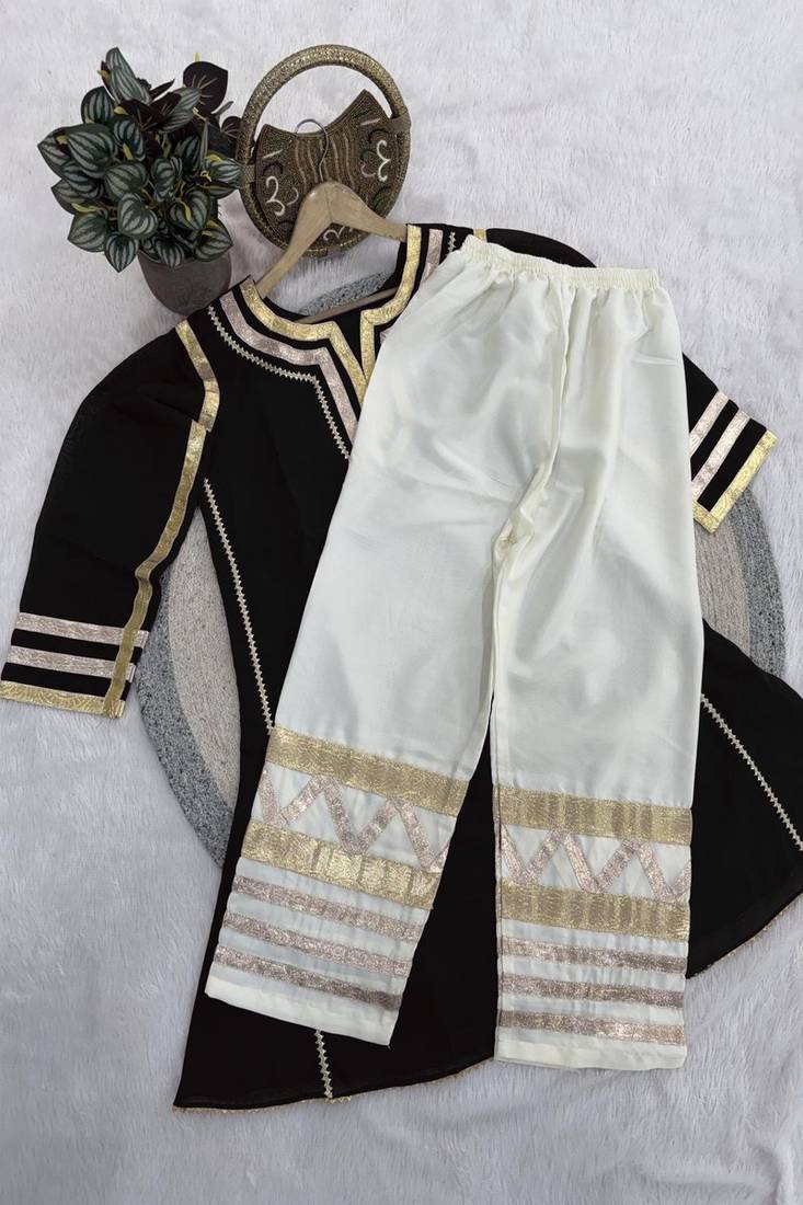 black flared kurta with gold border palazzo