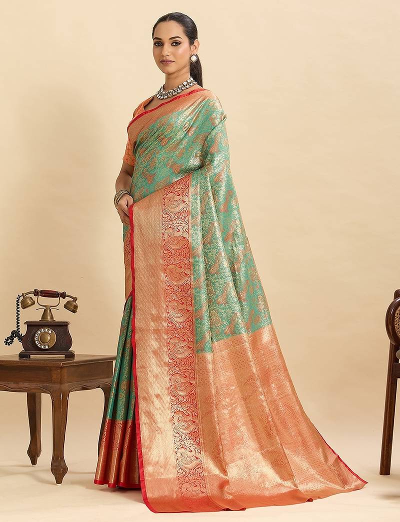 green art silk woven kanjivaram silk saree with blouses